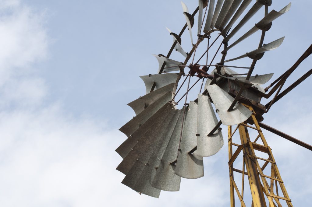 Old windmill over blue sky